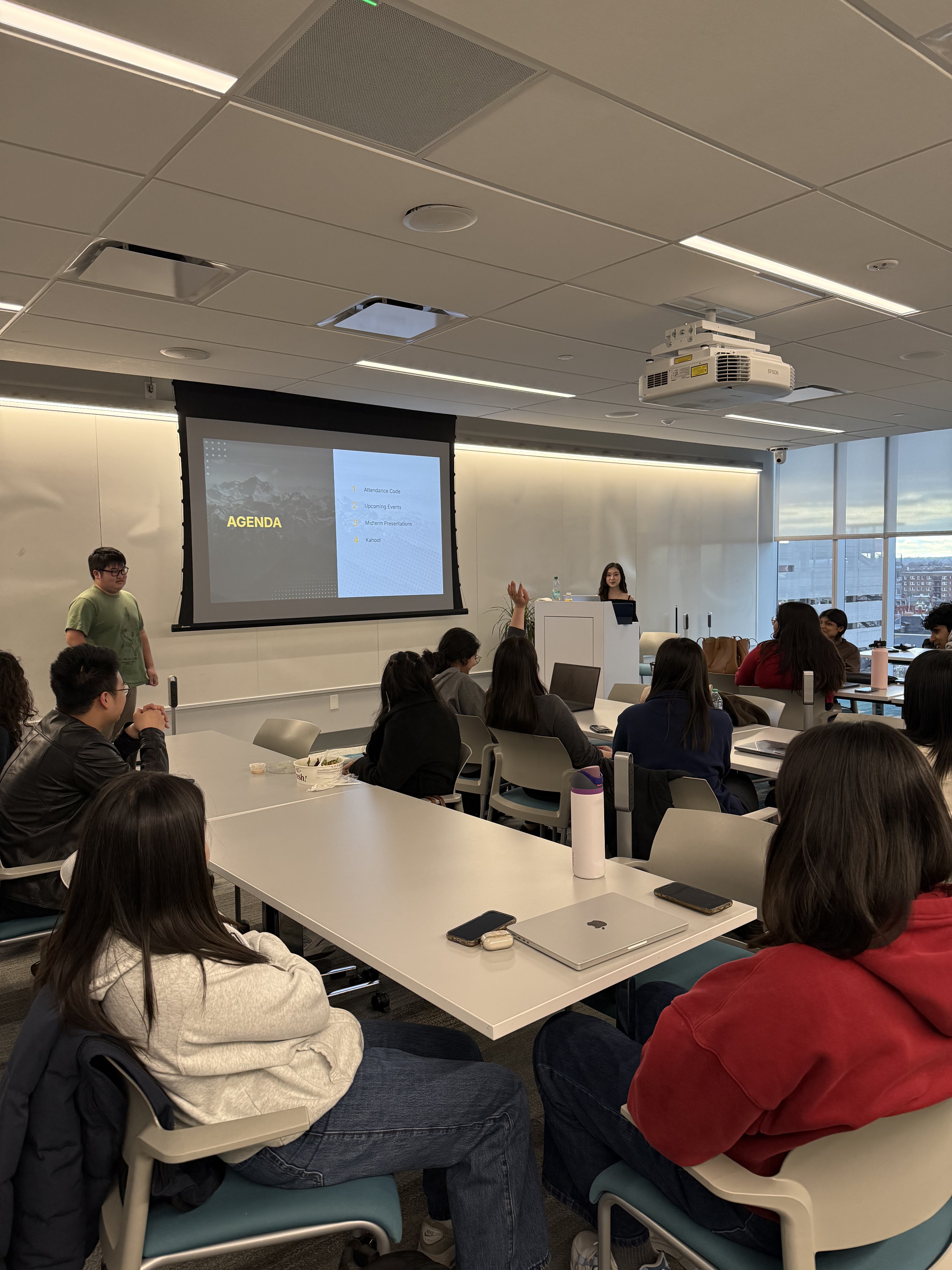 A presenter engaging the room at a general body meeting